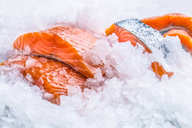 istock Close-up Fresh raw salmon fillets on Ice. 1003304046