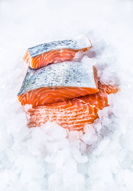 istock Close-up Fresh raw salmon fillets on Ice. 1003304056