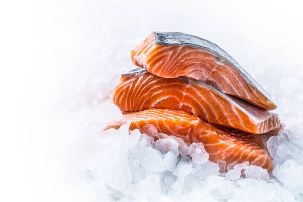 istock Close-up Fresh raw salmon fillets on Ice. 1003304072