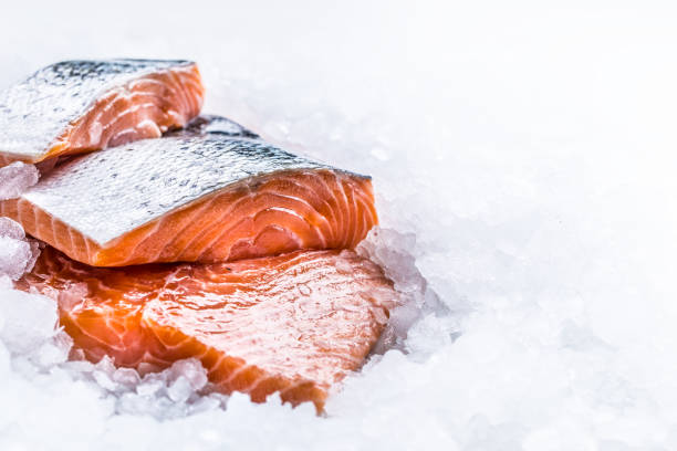 istock Close-up Fresh raw salmon fillets on Ice. 1003304076