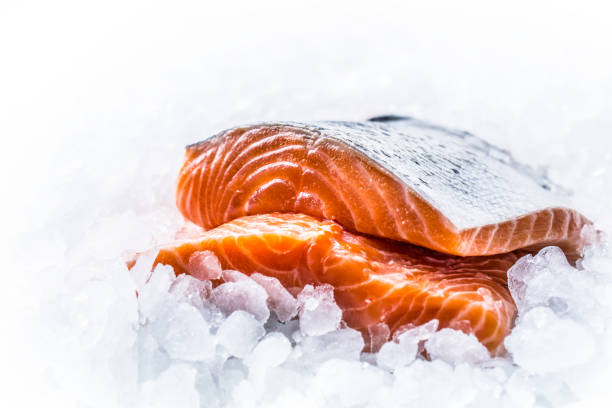 istock Close-up Fresh raw salmon fillets on Ice. 1003304078