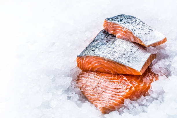 istock Close-up Fresh raw salmon fillets on Ice. 1003304082