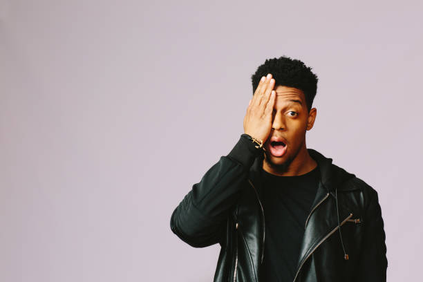 istock Young man holding head/ Oh my, this is awful 1003312344