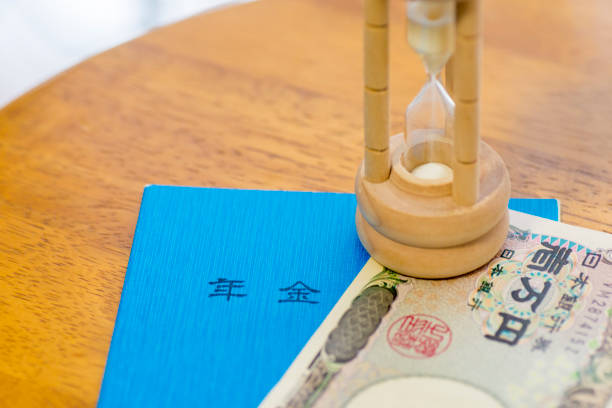 istock Japanese Ten Thousand Yen Note, Pension Book And Hourglass 1003316398