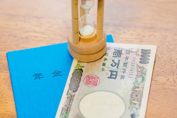 istock Japanese Ten Thousand Yen Note, Pension Book And Hourglass 1003316506