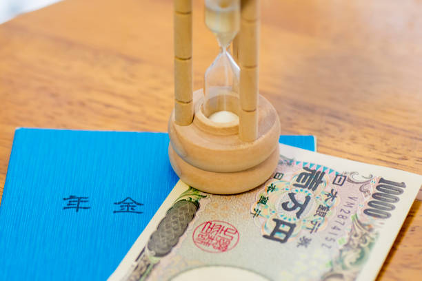 istock Japanese Ten Thousand Yen Note, Pension Book And Hourglass 1003318676