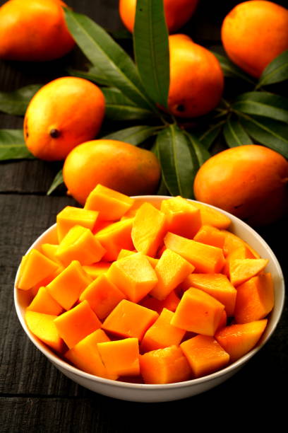 Fresh,cool mango salad. Bowl of fresh sweet mango salad mango fruit stock pictures, royalty-free photos & images