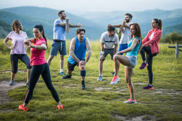 istock Large group of athletes warming up in the park. 1003319248