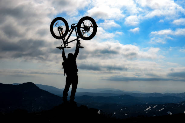 istock bicycle adventure in dangerous and wild mountains 1003321816