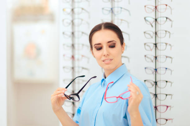 istock Girl Choosing Eyeglasses Frames in Optical Store 1003322006