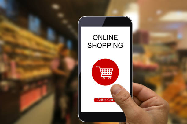 istock E-commerce internet shopping cart mobile phone app supermarket 1003328538