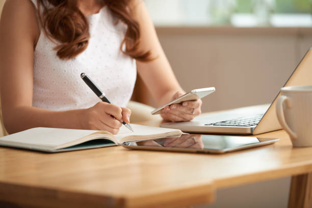 istock Business lady writing plans and ideas 1003328794