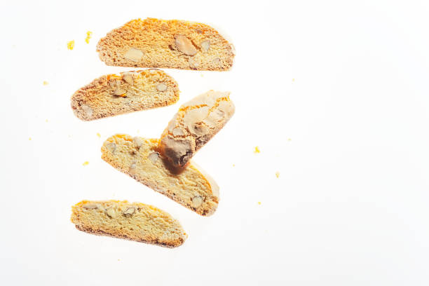 istock Traditional italian biscuits with almond cantuccini isolated on white background. Close up horizontal image with space for text. 1003329730