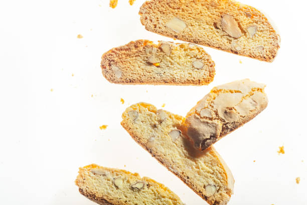 istock Traditional italian biscuits with almond cantuccini isolated on white background. Close up horizontal image with space for text. 1003331832