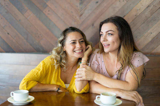 istock Dreamy beautiful girls discussing future plans and rumors 1003332426