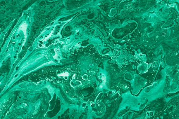 Marbling texture malachite color. Creative background with abstract oil painted handmade surface. Liquid paint.