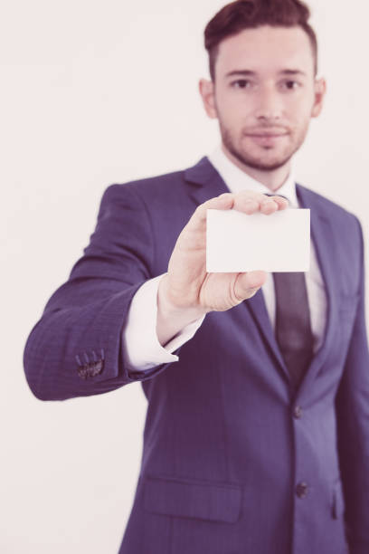 istock Modern male executive showing blank card 1003336402