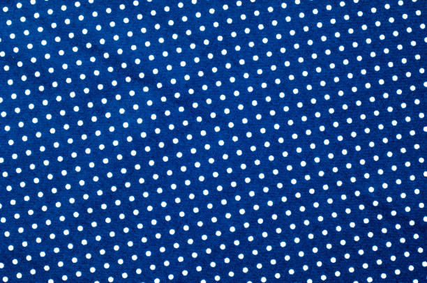 istock Texture background pattern. Abstract background of a luxurious blue fabric in white polka dots wavy folds of a grunge silk texture of a satin velvet material or a luxurious background or elegant wallpaper 1003343248
