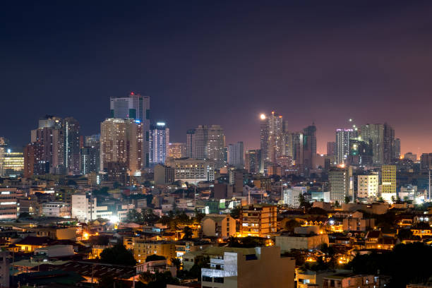 istock Manila skyline at night with high rise buildings 1003346234