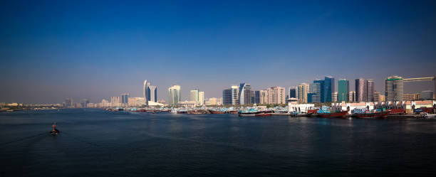istock Panorama with arabic boats aka Dhow at Dubai creek, UAE 1003350096