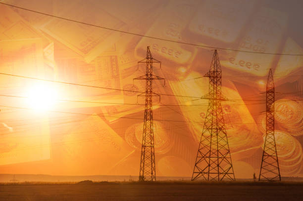 istock High-voltage power transmission line. Energy pillars. At sunset, 1003356966