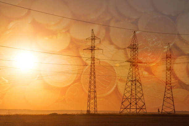 istock High-voltage power transmission line. Energy pillars. At sunset, Euro banknotes 1003356990