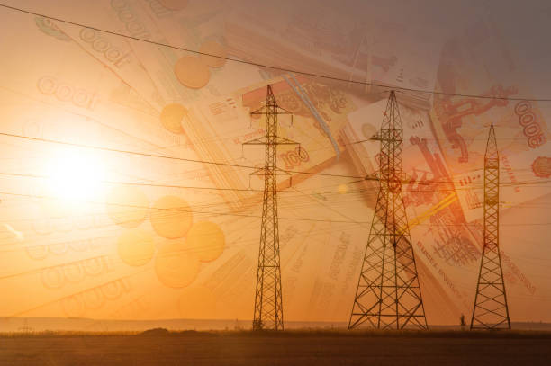 istock High-voltage power transmission line. Energy pillars. At sunset, Russian ruble 1003357012