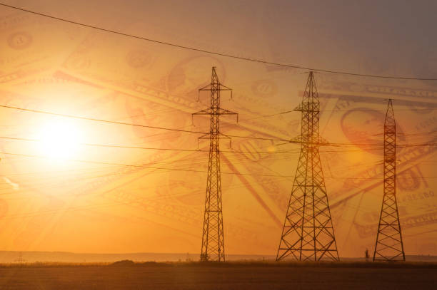 istock High-voltage power transmission line. Energy pillars. At sunset, U.S. dollars 1003357072