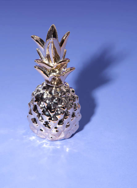 istock Tropical pineapple on ultraviolet background. Minimal concept art. 1003358156