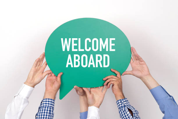 Group of people holding the WELCOME ABOARD written speech bubble Group of people holding the WELCOME ABOARD written speech bubble hello single word photos stock pictures, royalty-free photos & images