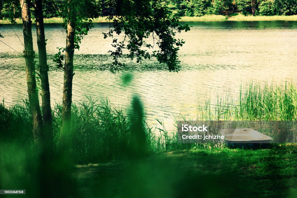 River landscape, tree, boat. Pure nature background. Summer concept River landscape, tree, boat. Pure nature background. Summer concept. Lithuania Stock Photo