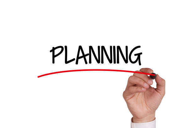 istock Hand writing PLANNING with Black Marker on Transparent Wipe Board 1003372918