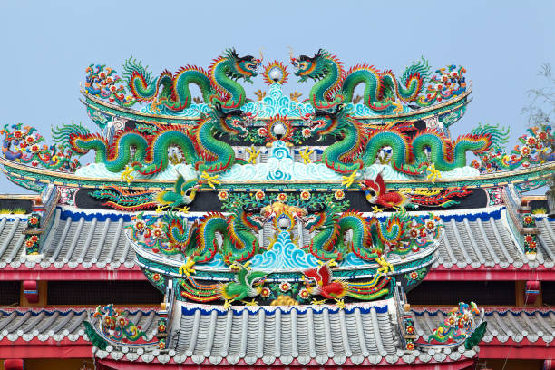 istock Chinese dragon statue on the roof. 1003376864