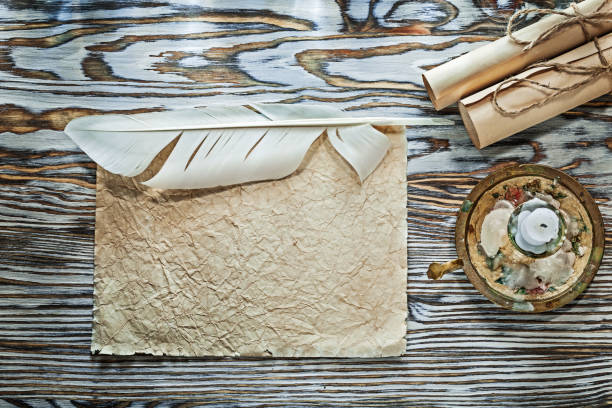 istock Vintage paper rolls crumpled document plume candlestick candle 1003379894