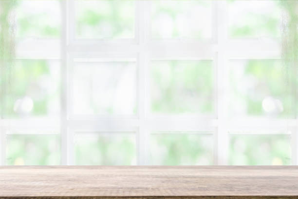 istock Empty wooden table and window room interior decoration background, product montage display,can be used for display or montage your products.Mock up for display of product. 1003381108