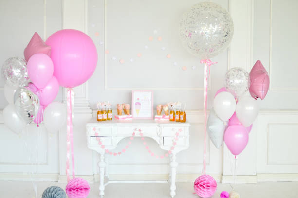 istock Birthday decorations. Balloons pink and white. 1003383770