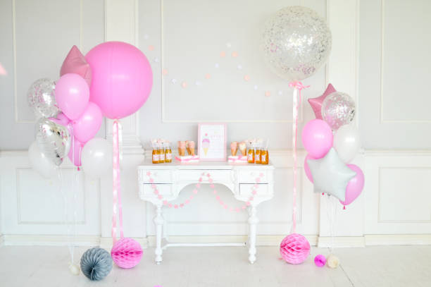 istock Birthday decorations. Balloons pink and white. 1003383840