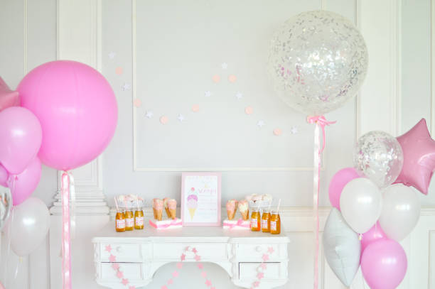 istock Birthday decorations. Balloons pink and white. 1003384182