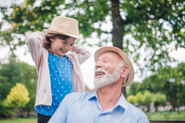 istock Smiling multi generation family at the park 1003384856