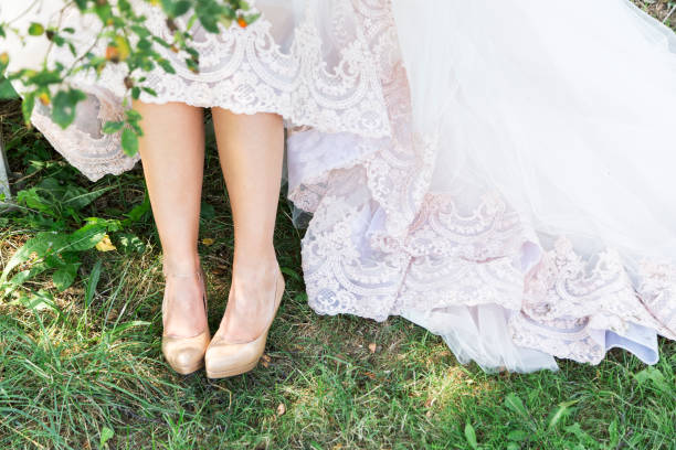 istock Bride in beautiful shoes outdoors 1003390330