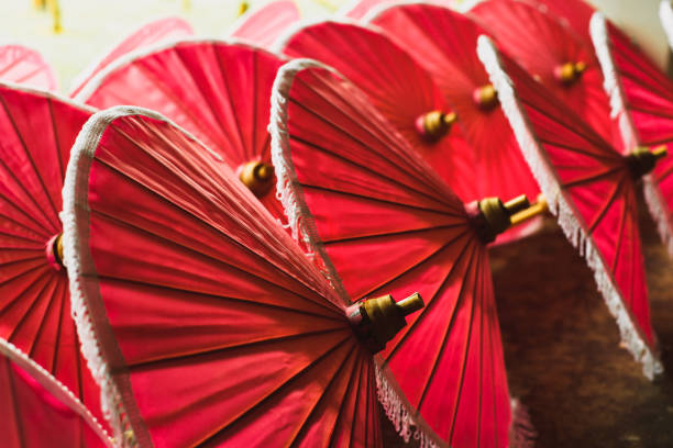 istock red paper fabric traditional asian umbrellas 1003393674
