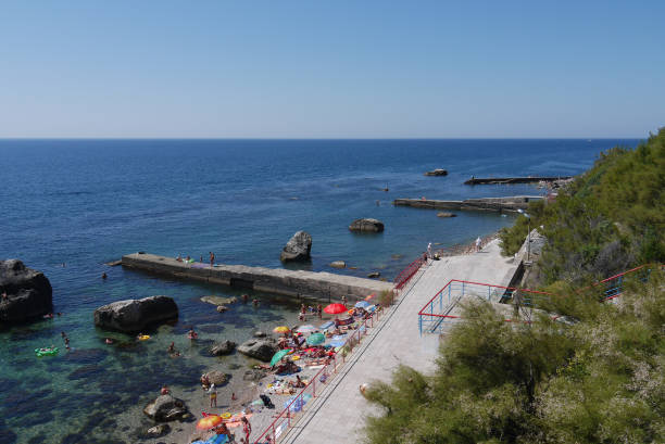 istock Several waveguides go from shore to sea. Between them there are big stones 1003395460