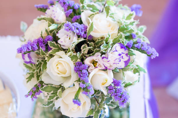 istock beautiful bouquet of bright white rose flowers on table 1003402548