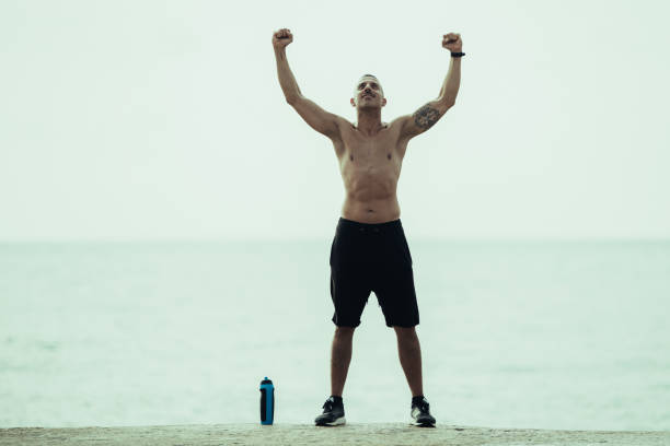 istock Strong muscled man showing his power 1003403354