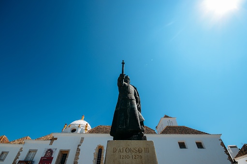 Faro, Portugal - July 16, 2018: View of the statue of the first king of Portugal, D.Afonso III, located on Faro, Portugal.