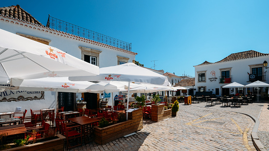 Faro, Portugal - July 16, 2018: Restaurant terrace in the historic centre of Faro, Algarve, Portugal