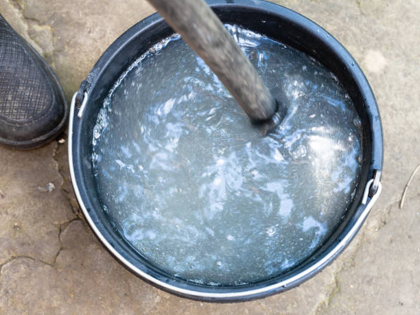 istock string chemicals by stick in bucket outdoors 1003408342