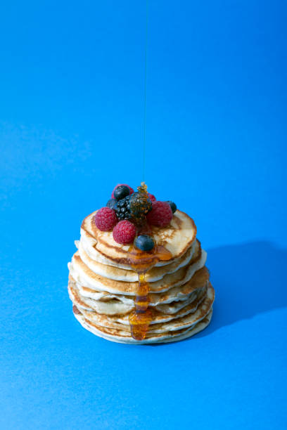 istock Pancakes with berries and honey. Copy space for text 1003408698