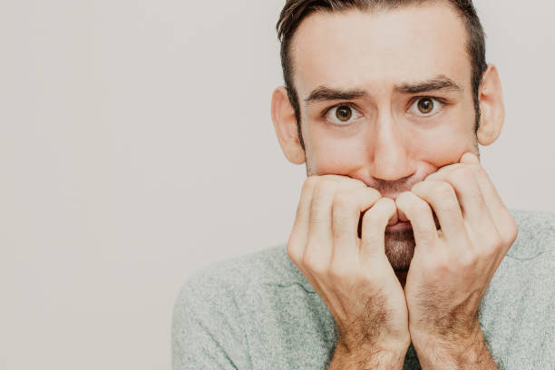istock Closeup of Nervous Young Man Freaking Out 1003411080