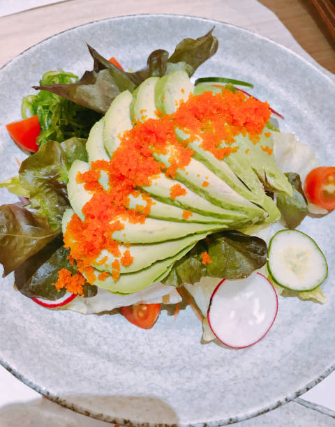 istock Vegetable salad served with sliced avocado and shrimp eggs. 1003416022